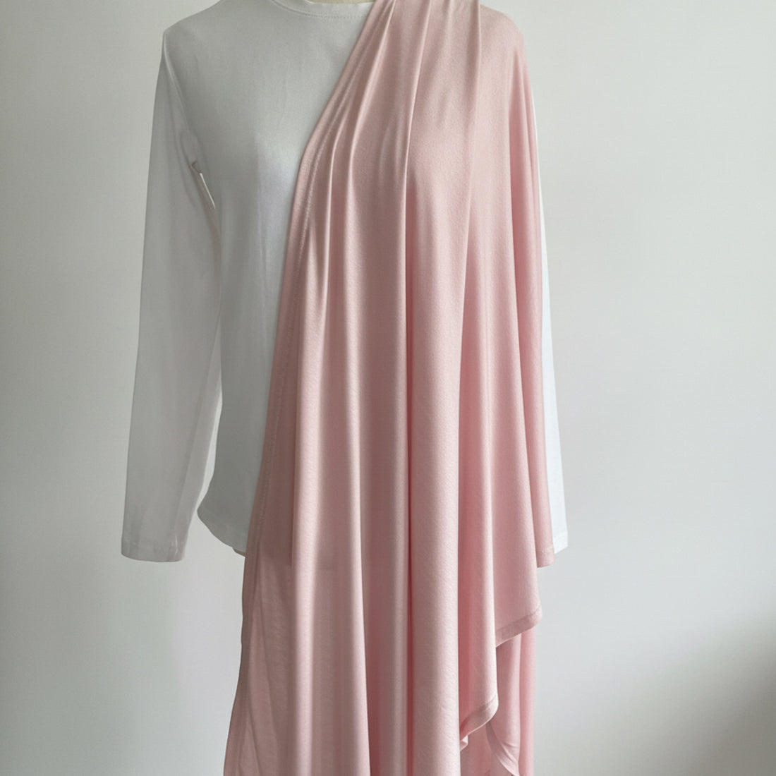 Soft, stretchy, and comfortable, our Jersey Hijab offers a secure non-slip fit with a delicate blush tone for effortless everyday elegance.